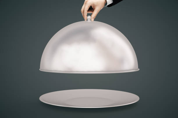 istock Hand opening cloche dark background 538984384