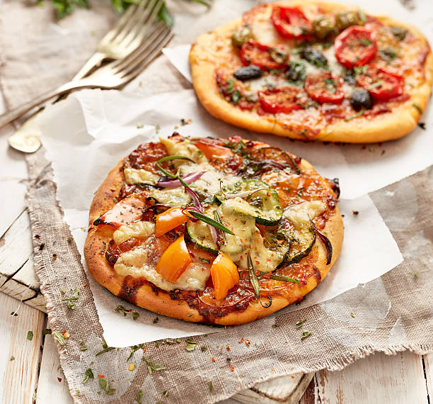 istock Small homemade pizzas with addition of vegetables 538985908