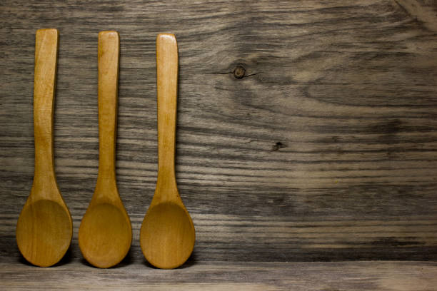 istock Wooden kitchen spoon on wooden background. Space for text. 538986586