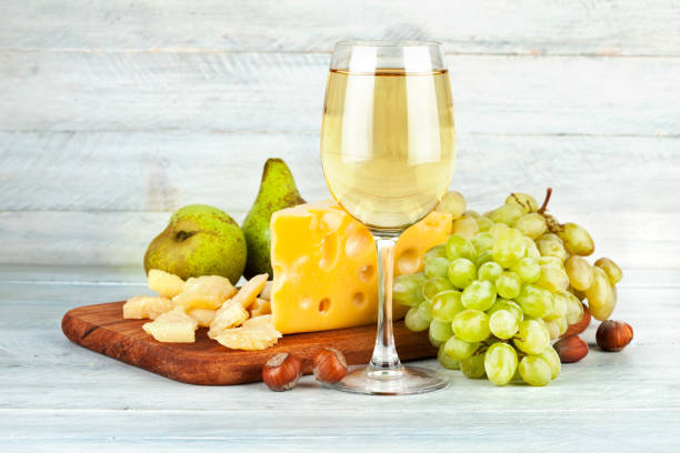 istock Wineglass white wine with fruits nut 538986594