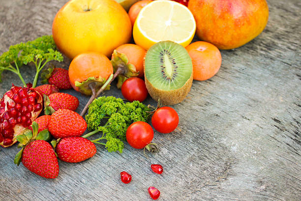 istock Fruits, vegetables on wooden background 538988117