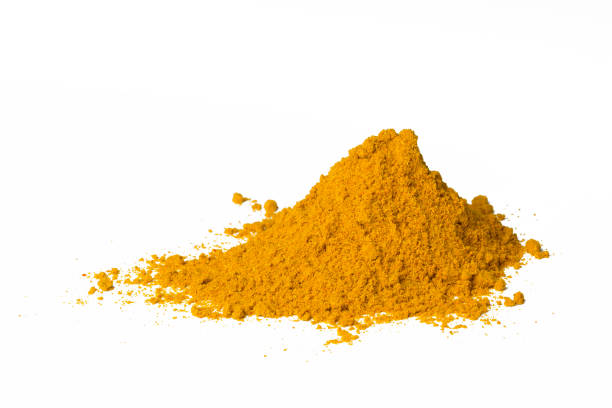 istock Curry powder heap isolated on white 538988386
