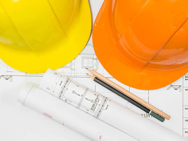istock Architectural blueprint of office building with a pencils and He 538989039