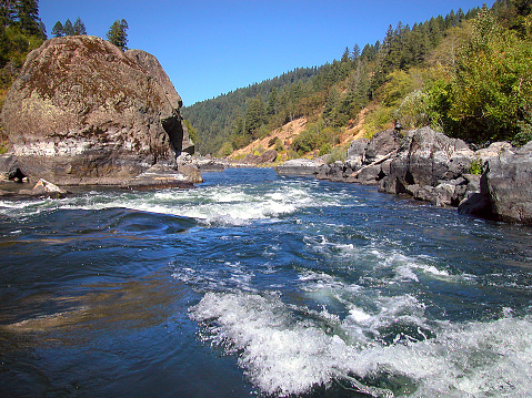 The Rogue River in southwestern flows about 215 miles (346 km) in a westward direction from the Cascade Range to the Pacific Ocean. Known for its salmon runs, whitewater rafting, and rugged scenery, it was one of the original eight rivers named in the Wild and Scenic Rivers Act of 1968.