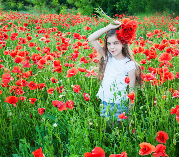 istock Girl in the poppy field 538990084