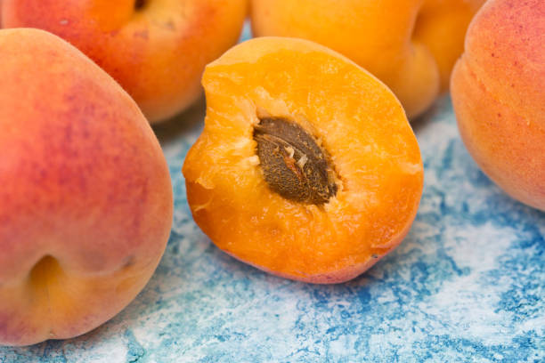istock Fresh ripe apricots on a turquoise background 538990772