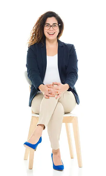 Photo of Cheerful businesswoman sitting on chair