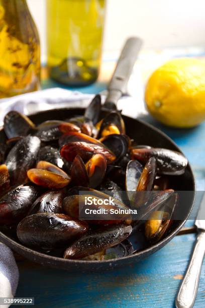 Freshly Cooked Mussels In An Old Pan Stock Photo - Download Image Now - Appetizer, Backgrounds, Boiled