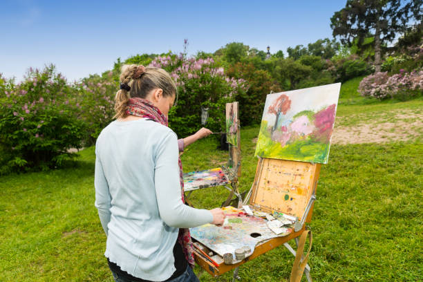 istock Back view of a concentrated female painter during art class 538996500
