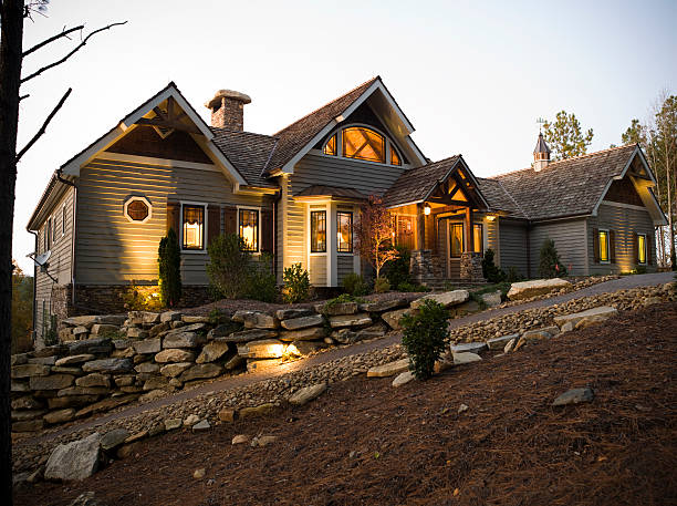 Garage Entrance A garage entrance to a home with a brick driveway. landscape lighting stock pictures, royalty-free photos & images