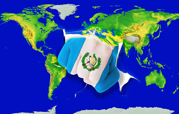 istock Fist in flag of guatemala punching world map 538997971