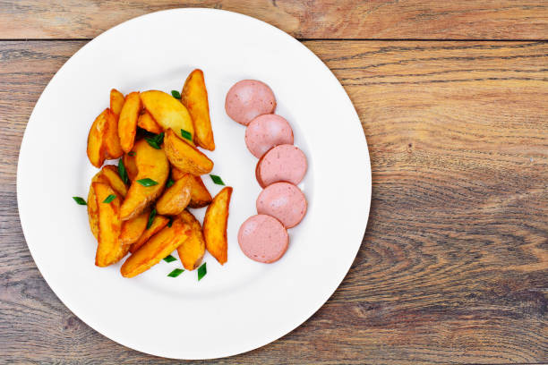 Fried Potato Wedges in a Rural and Sausage Studio Photo