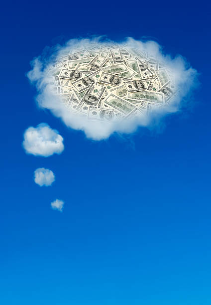 istock Dreaming of wealth - thought bubble cloud with dollars inside. 539000820