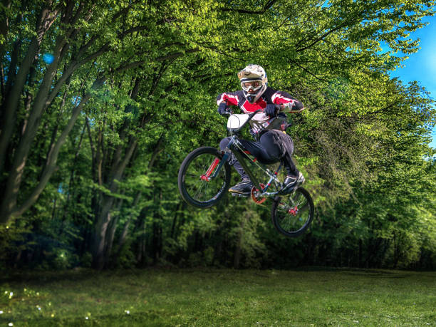 istock Man riding bmx bike performing a trick 539001228