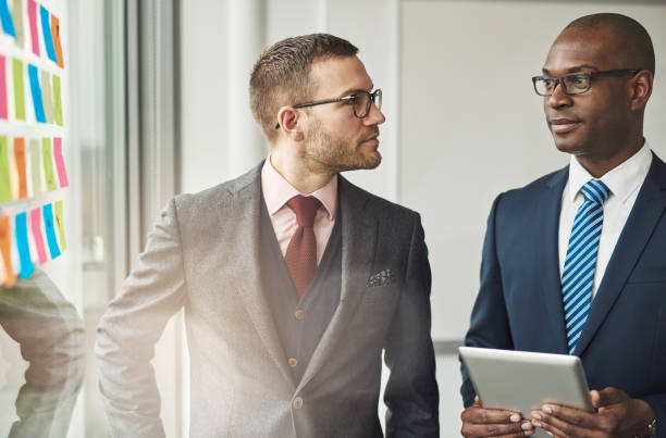 istock Two stylish corporate executives in a discussion 539001806