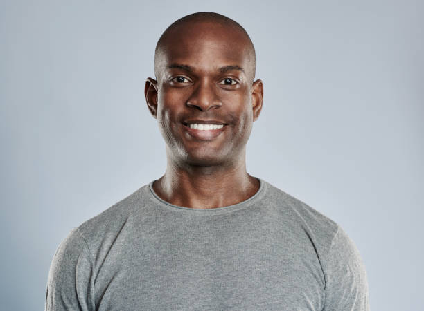 istock Handsome black man with pleasant smile in gray 539002042