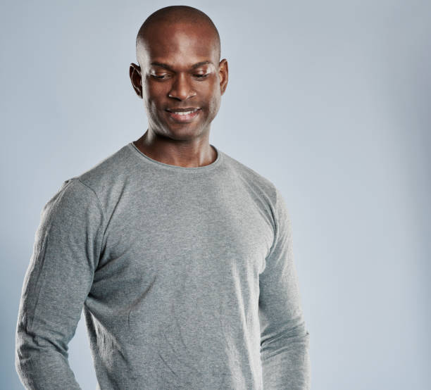 istock Grinning African man in gray shirt with copy space 539002108