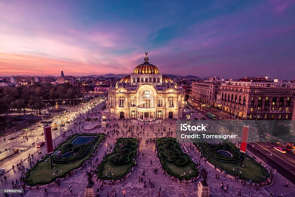 Mexico City's Downtown At Twilight Fantastic view Mexico City's downtown at twilight. The nightlife of the city can be seen around the Palacio de Bellas Artes building in foreground. Mexico City Stock Photo