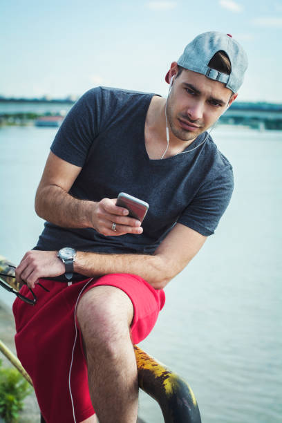 istock Handsome guy looking at the camera next to the river 539003684