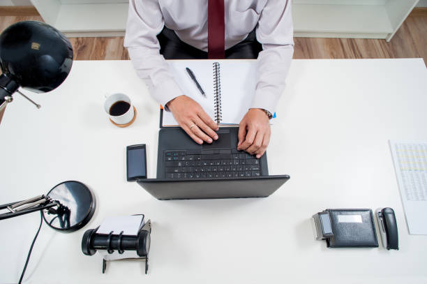 istock manager works in office behind the desk 539005864