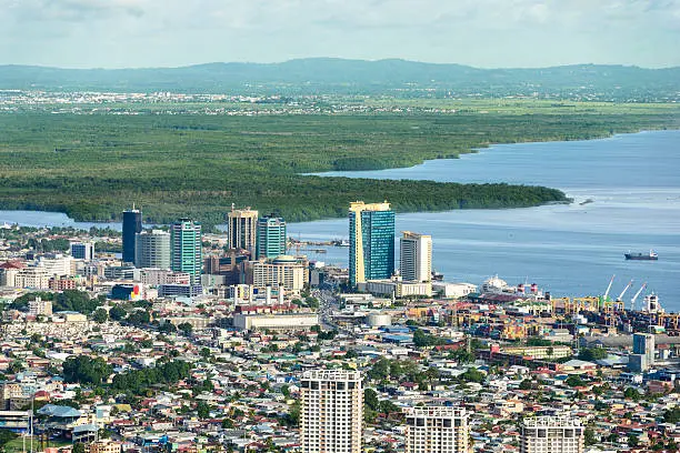 View from above of Skyline downtown Port of Spain city. Buildings by the port with Caroni area on the background.