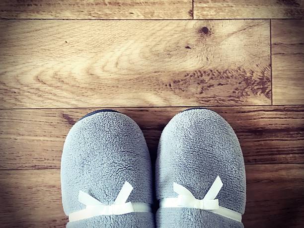 Pile of gray traditional felt slippers.
