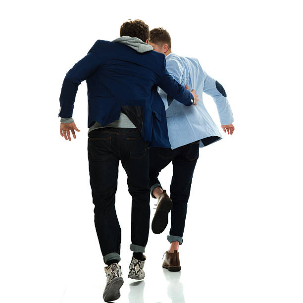 istock Rear view of brothers running together 539011670
