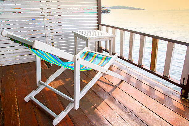 istock beach chair and a table on terrace sea view 539013164