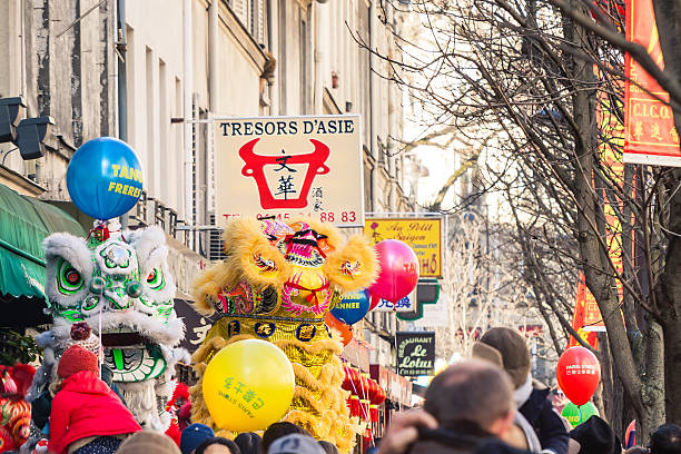 Paris, France - February 22, 2015: People celebrating Chinese New Year Eve 2015 and Year of The Goat in the street of Paris, France
