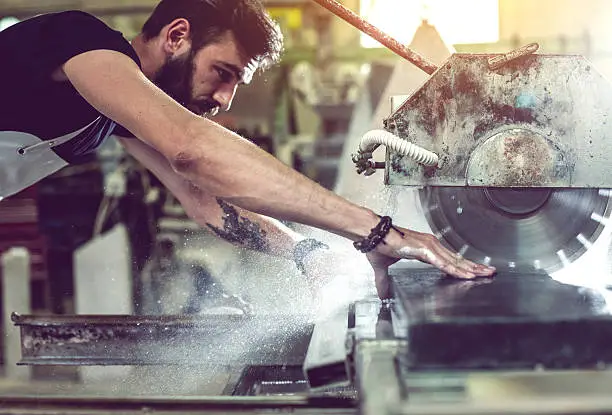 Stonecutter at his workshop, Ljubljana, Slovenia