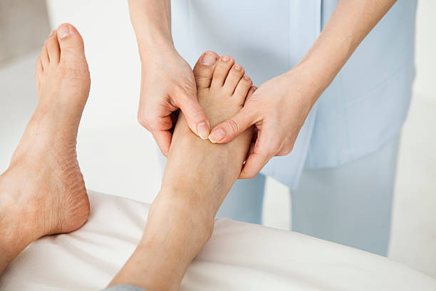 istock Doctors are carefully massage a woman's foot 539019420