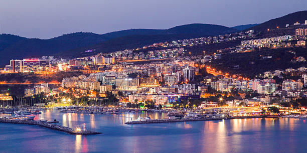 panorama von kusadasi - sea aegean sea night illuminated stock-fotos und bilder