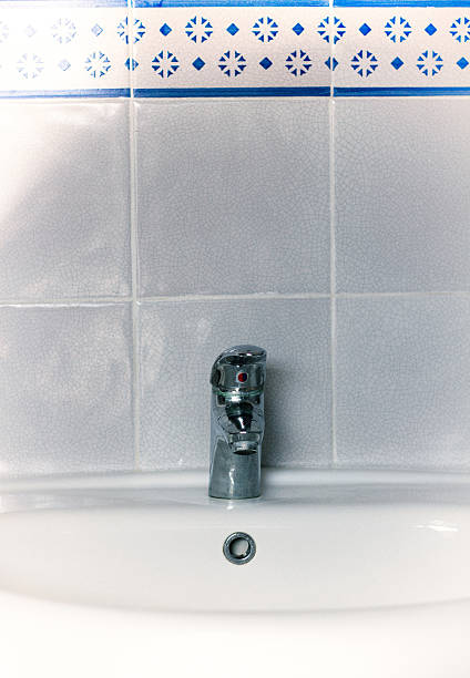 istock Vintage White Bathroom Sink with Tile Backsplash (Close-Up) 539020646
