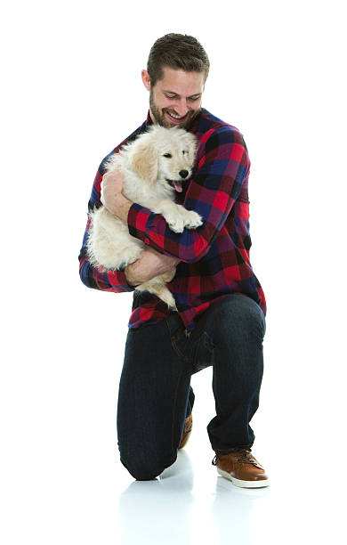 istock Smiling casual man embracing with his dog 539023204