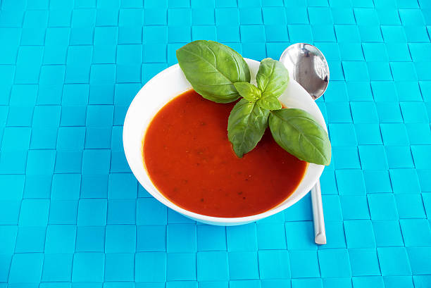 Tomato and basil soup decorated with basil leaves