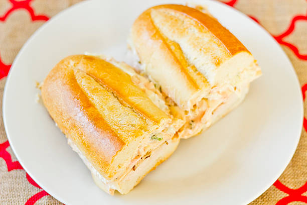 Turkey Reuben Healthy alternative, turkey reuben on a torpedo roll with cole slaw dressing torpedo sandwich stock pictures, royalty-free photos & images