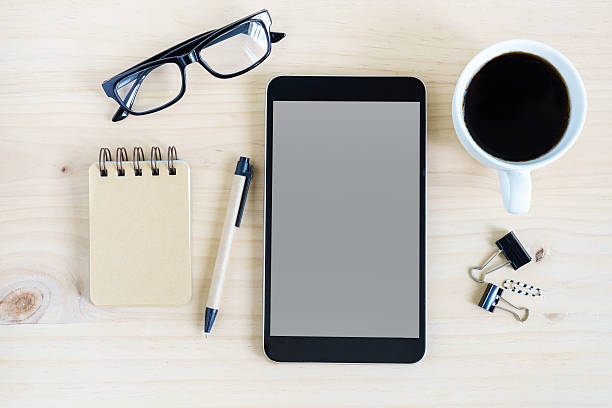istock Tablet and a cup of coffee on desk office 539025680