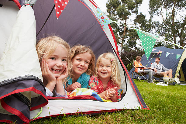 Family Enjoying Camping Holiday On Campsite stock photo
