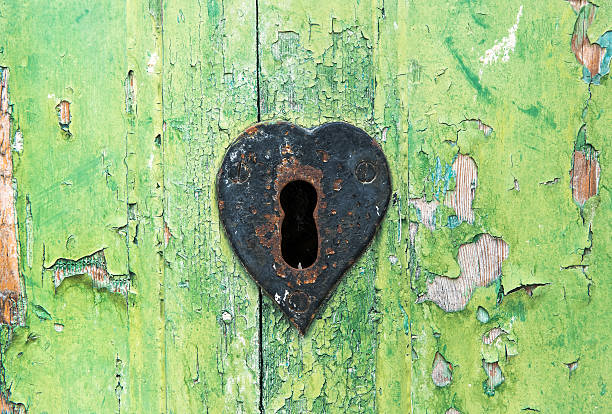 istock Old grungy green door and rusted lock 539026278