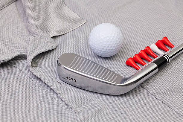 istock Grey polo shirt and golf equipments 539027186