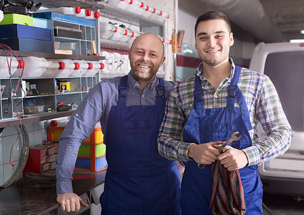 istock Workmen in auto repair shop 539027465
