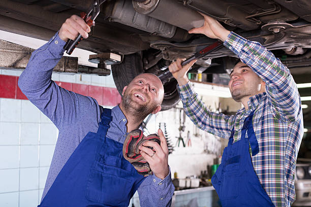 istock Professional mechanics repairing car 539027799