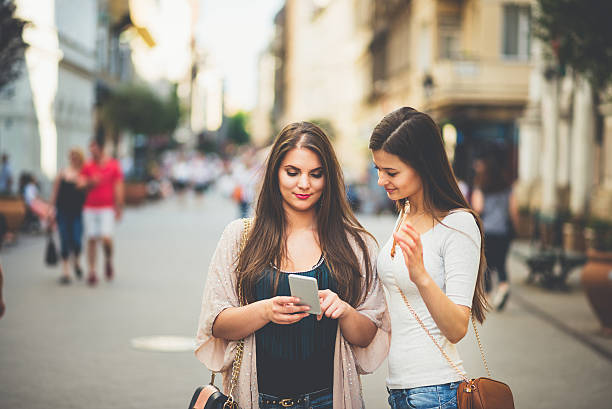 istock two women with phone in the Budapest 539028206