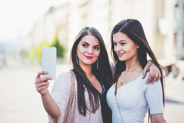 istock two women with phone in the Budapest 539028304