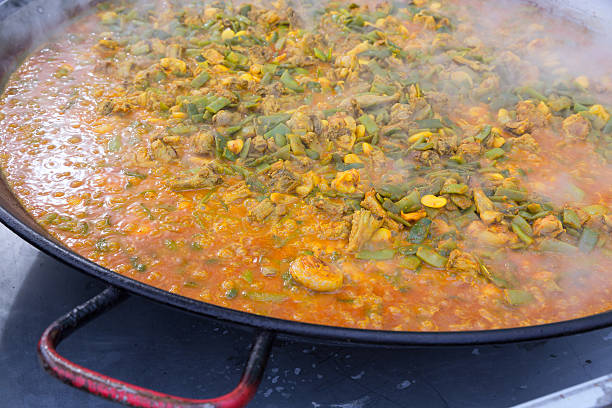 istock Cooking paella typical from Valencia Spain recipe with rice 539039287