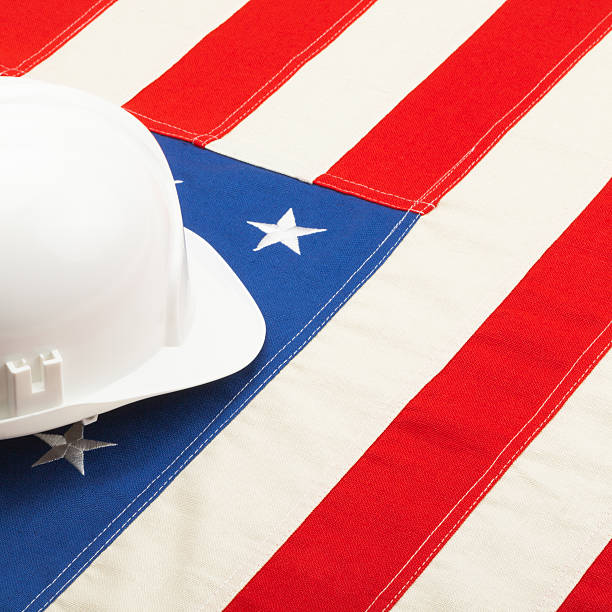 istock White color construction helmet over USA flag 539039405