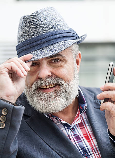 istock Attractive old man with beard and hat 539039857