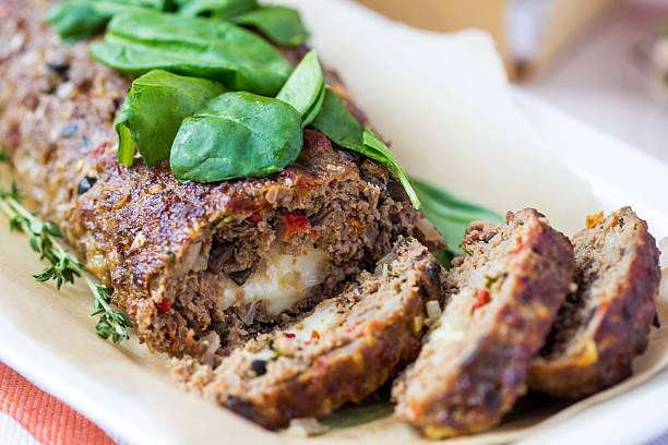 Meat roll, meatloaf, minced beef with vegetables, olives stock photo