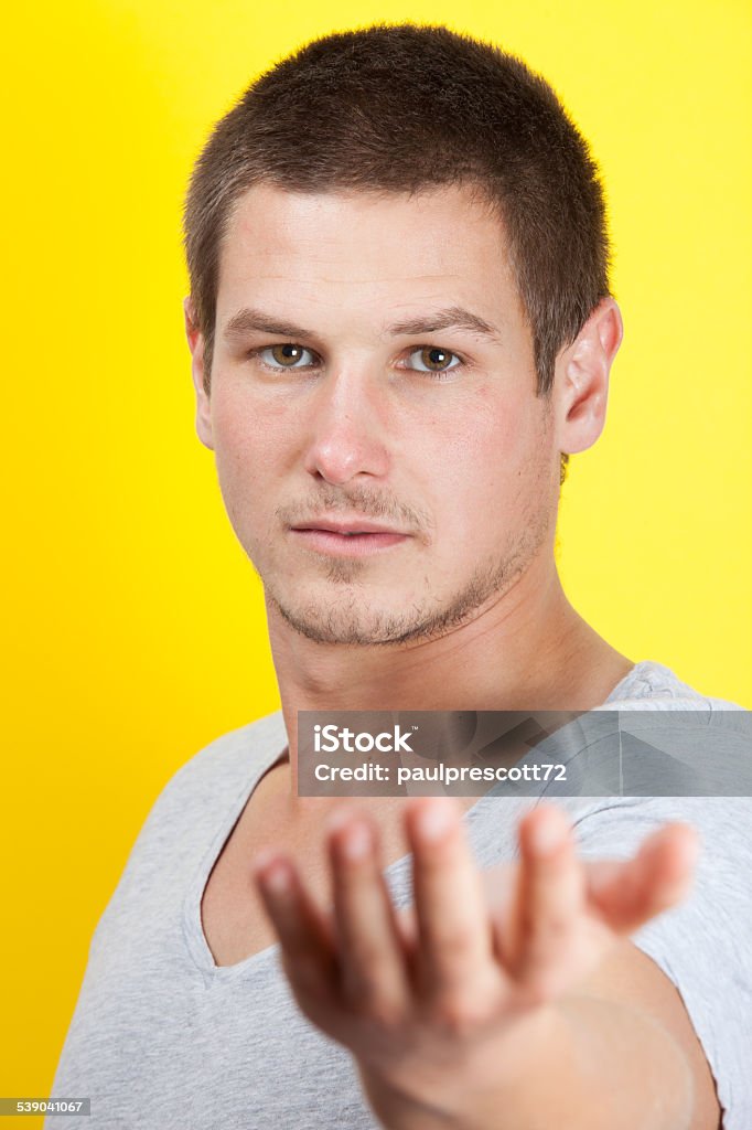 young man giving hand Kind young man giving out his hand 20-29 Years Stock Photo