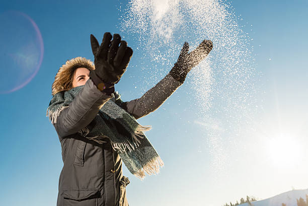 istock `Happy  woman posing against high snowy mountains 539043077